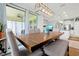 Spacious dining area with a large table, ample seating, and a view of the outdoor patio at 16527 Sea Glass St, Winter Garden, FL 34787