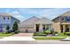 Charming single-story home featuring a well-manicured front yard, a two-car garage, and a welcoming covered entry at 16527 Sea Glass St, Winter Garden, FL 34787