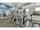 A modern community gym featuring a line of treadmills with individual televisions for entertainment at 16527 Sea Glass St, Winter Garden, FL 34787