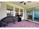 Covered patio with outdoor kitchen, grill, and ample space for entertaining at 16527 Sea Glass St, Winter Garden, FL 34787