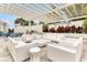 Inviting outdoor patio space with comfortable seating and pergola perfect for relaxing and entertaining at 16527 Sea Glass St, Winter Garden, FL 34787