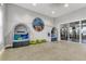 Playroom with cozy reading nooks, colorful decor, and view to a fitness center for entertainment at 16527 Sea Glass St, Winter Garden, FL 34787