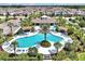 Stunning aerial view of a resort-style community pool and recreation area, perfect for relaxation at 16527 Sea Glass St, Winter Garden, FL 34787