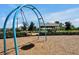 Community swing set overlooking landscaped green space in a park-like setting at 16527 Sea Glass St, Winter Garden, FL 34787