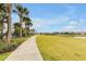 A well-maintained walking path meandering through lush green spaces, perfect for a relaxing stroll at 16527 Sea Glass St, Winter Garden, FL 34787