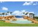 Waterleigh's stunning water feature with rock formations and palm trees creates a grand entrance at 16527 Sea Glass St, Winter Garden, FL 34787