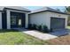 Charming single-story home boasts modern architecture, neat landscaping, and a welcoming entrance at 17380 Sw 36Th Ave Rd, Ocala, FL 34473