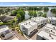 Aerial view of lakeside townhomes with serene water views, showcasing a desirable community setting at 1768 Mondrian Cir, Winter Park, FL 32789
