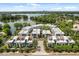 Aerial of stylish, modern waterfront townhomes with scenic lake and city views at 1768 Mondrian Cir, Winter Park, FL 32789
