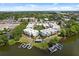 Aerial view of modern waterside townhomes with docks, showcasing a desirable residential community at 1768 Mondrian Cir, Winter Park, FL 32789