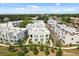 Aerial view of modern townhomes with green landscaping, showcasing the community layout at 1768 Mondrian Cir, Winter Park, FL 32789