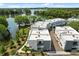 Townhome aerial view highlighting waterfront living, surrounded by lush trees at 1768 Mondrian Cir, Winter Park, FL 32789