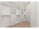 Spacious closet with custom shelving, drawers and clothes rods providing ample storage space at 1768 Mondrian Cir, Winter Park, FL 32789