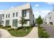 Contemporary home showcasing clean lines, large windows, and professionally landscaped grounds at 1768 Mondrian Cir, Winter Park, FL 32789