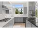 Well-lit kitchen equipped with stainless steel appliances and a sleek gray color scheme at 1768 Mondrian Cir, Winter Park, FL 32789
