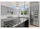 Modern kitchen featuring gray cabinets, sleek countertops, and stainless steel appliances at 1768 Mondrian Cir, Winter Park, FL 32789