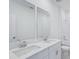 Bathroom featuring double sinks, quartz countertops and new fixtures at 1801 Archer Dr, Minneola, FL 34715