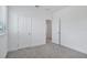 Bedroom featuring plush carpeting, a bright window, and white trim at 1801 Archer Dr, Minneola, FL 34715