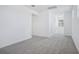 Upstairs hallway with carpet and natural light at 1801 Archer Dr, Minneola, FL 34715