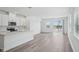 Open floor plan showcases a modern kitchen with an island and a view into the living area at 1801 Archer Dr, Minneola, FL 34715