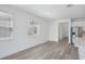 Bright living room with hardwood floors, natural light and stainless steel appliances at 1801 Archer Dr, Minneola, FL 34715