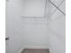 White walk-in closet with neutral carpeting and wire shelving at 1801 Archer Dr, Minneola, FL 34715