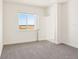 Bright bedroom with neutral carpet, white walls, and a scenic window view at 1812 Archer Dr, Minneola, FL 34715