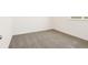 Neutral carpet and white trim throughout this comfortable, light-filled bedroom at 1812 Archer Dr, Minneola, FL 34715