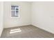 Neutral bedroom featuring carpet, one window, and white walls at 1812 Archer Dr, Minneola, FL 34715