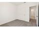 Bedroom featuring neutral carpet and access to a bathroom at 1812 Archer Dr, Minneola, FL 34715