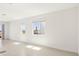 Bright living room with large windows, tile floors, and neutral walls, offering a serene space at 1812 Archer Dr, Minneola, FL 34715
