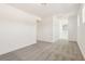 Bright living room with neutral carpet, white walls, and natural light from the windows at 1812 Archer Dr, Minneola, FL 34715
