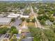 An aerial view of a residential neighborhood with tree-lined streets and various building types at 1845 Delaney Ave, Orlando, FL 32806