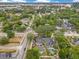 An aerial view of a suburban neighborhood featuring tree-lined streets with an in-ground pool at 1845 Delaney Ave, Orlando, FL 32806