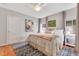 Cozy bedroom featuring a plush bed with decorative pillows and a colorful throw blanket, perfect for relaxation at 1845 Delaney Ave, Orlando, FL 32806