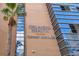Modern building featuring a Cancer Institute with a palm tree in the front at 1845 Delaney Ave, Orlando, FL 32806