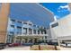 Exterior shot of a glass building with a fountain and several vehicles outside at 1845 Delaney Ave, Orlando, FL 32806