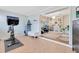 Exercise area or living area with Peloton bike and home office beyond at 1845 Delaney Ave, Orlando, FL 32806