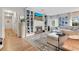 Bright living room with hardwood floors, a large sectional, fireplace, and built-in shelving at 1845 Delaney Ave, Orlando, FL 32806
