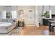 Bright living room with hardwood floors, white walls, and stylish decor. Windows offer natural light at 1845 Delaney Ave, Orlando, FL 32806