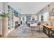 Bright living room with fireplace, built-in shelving, a large sectional, and hardwood floors at 1845 Delaney Ave, Orlando, FL 32806