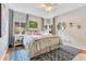 Bright main bedroom with a large bed, stylish rug, and plenty of natural light at 1845 Delaney Ave, Orlando, FL 32806