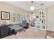 Well-lit home office featuring a desk, a chair, built-in bookshelves, and bright natural light at 1845 Delaney Ave, Orlando, FL 32806