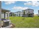 Spacious backyard with a view of multiple homes at 1904 Archer Dr, Minneola, FL 34715