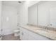 Bathroom featuring double vanity with granite counters and a shower/tub combo at 1904 Archer Dr, Minneola, FL 34715