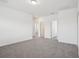 Spacious bedroom with neutral carpet, ample natural light, and multiple entryways at 1904 Archer Dr, Minneola, FL 34715