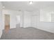 Upstairs bonus room featuring plush carpet and multiple entryways at 1904 Archer Dr, Minneola, FL 34715