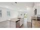 Spacious kitchen with granite countertops, stainless steel appliances, and an open view to the backyard at 1904 Archer Dr, Minneola, FL 34715