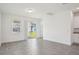 Bright living area with tile flooring, connecting seamlessly with the kitchen and outdoor access at 1904 Archer Dr, Minneola, FL 34715