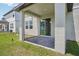Back patio featuring a sliding door entry to the home and column supports at 1904 Archer Dr, Minneola, FL 34715